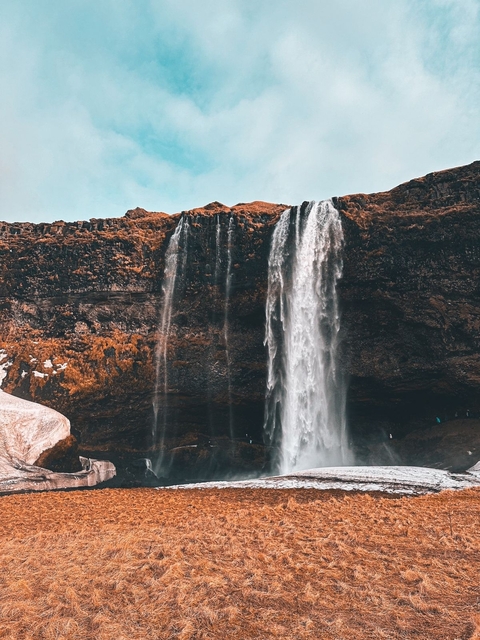 Waterfall cascading down a cliff.