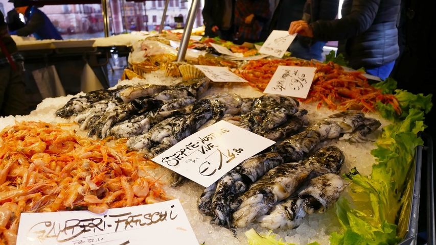 Various seafood displayed at a market.