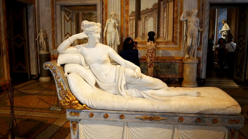 Reclining woman statue in an art gallery.