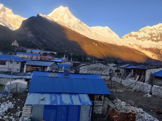 Village landscape with mountain backdrop