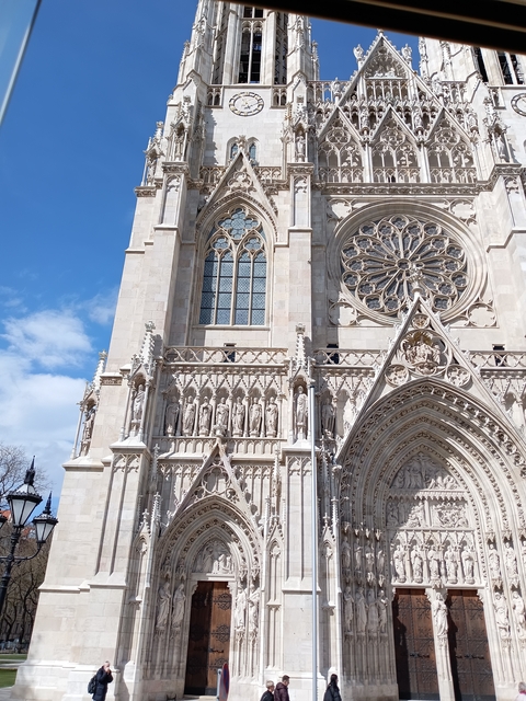 A gothic cathedral with intricate detailing and a rose window.