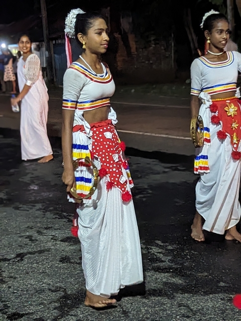 Traditional dancers preparing for a performance.