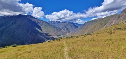 Vast valley with a clear sky and distant mountains.
