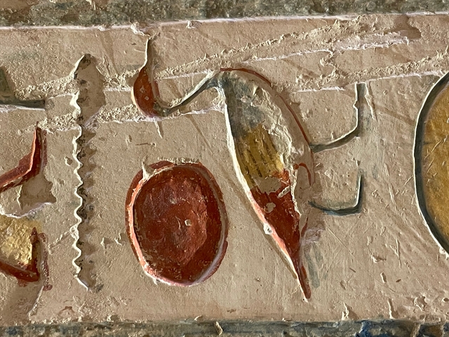 Close-up of ancient Egyptian carvings in a wall.
