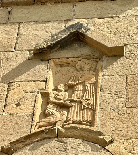 Detailed stone carving on an ancient structure.