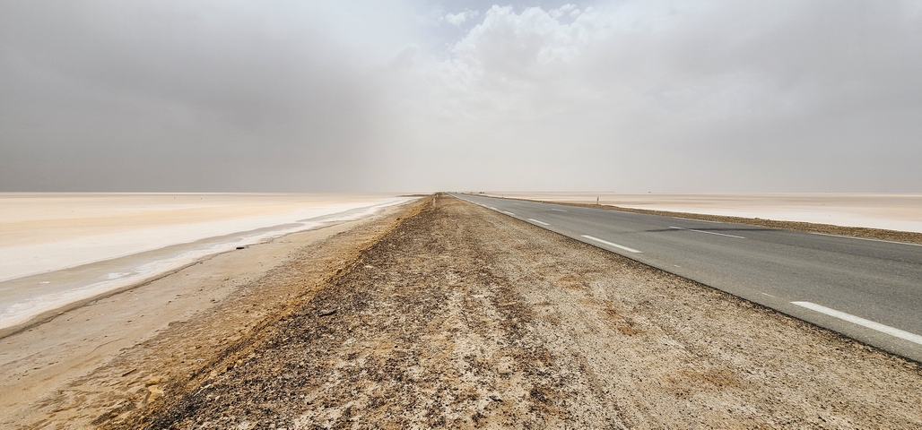 Desert road stretching into the horizon.