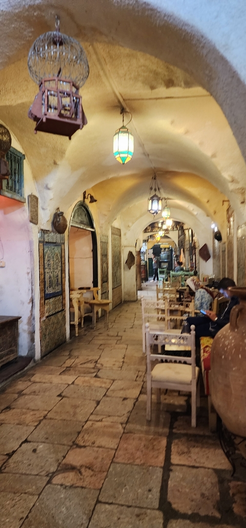Indoor market scene with bright decor, but slightly blurry.