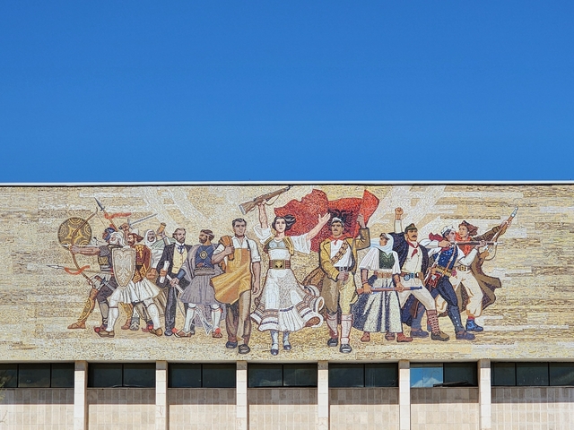 Mosaic mural with historical figures.