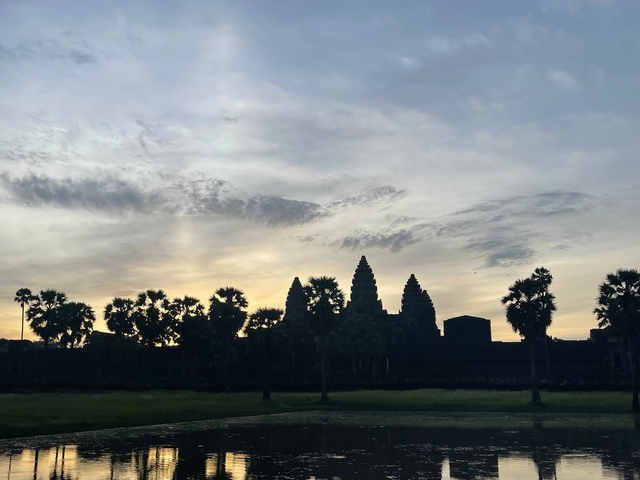 Angkor Wat against the backdrop of a colorful sky.