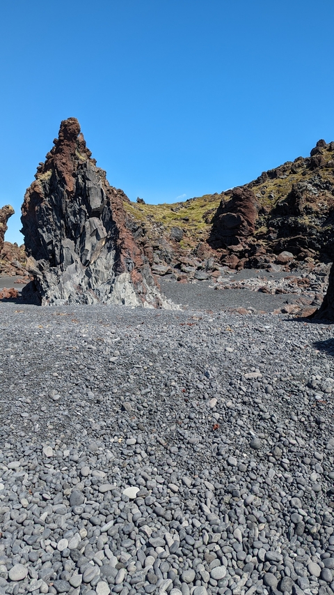 Rocky beach with unique geological formations.