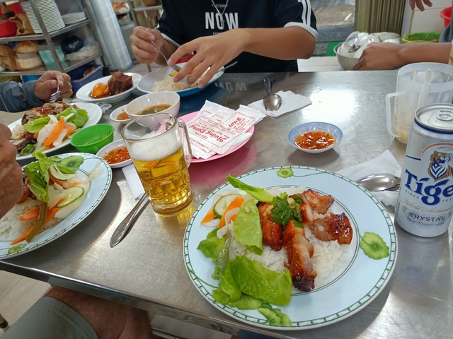 People eating traditional food at a local restaurant.