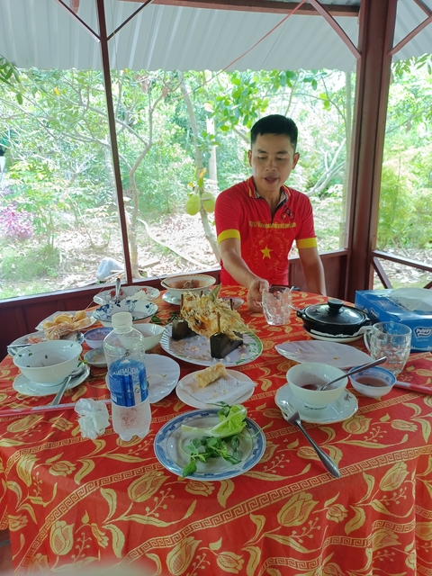 Eating area with a spread of Vietnamese dishes.