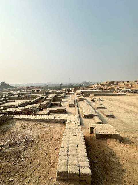 Wide view of an ancient archaeological site with ruins.