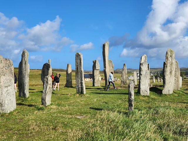 Stone circle with people walking around.