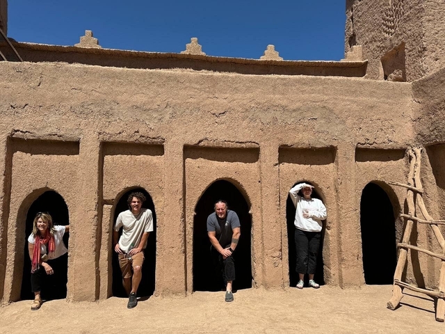 Tourists posing within an ancient kasbah