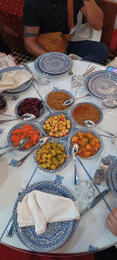 Colorful bowls of various Moroccan side dishes