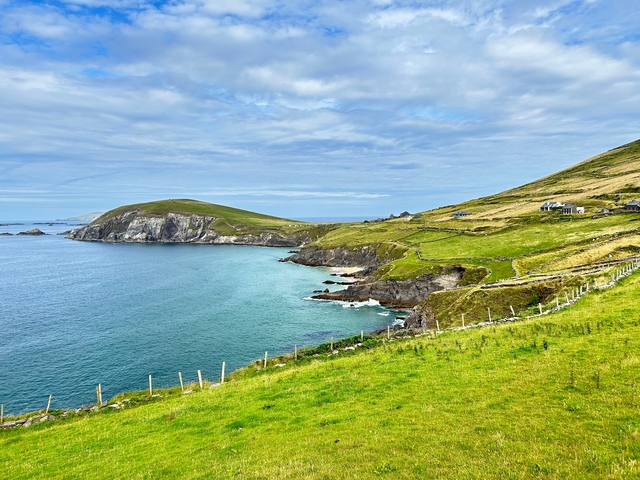 Coastal landscape with cliffs and ocean.