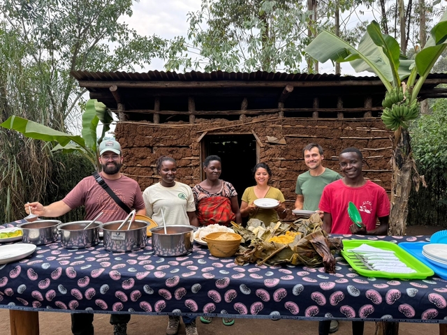 Group of people having a meal together outdoors.