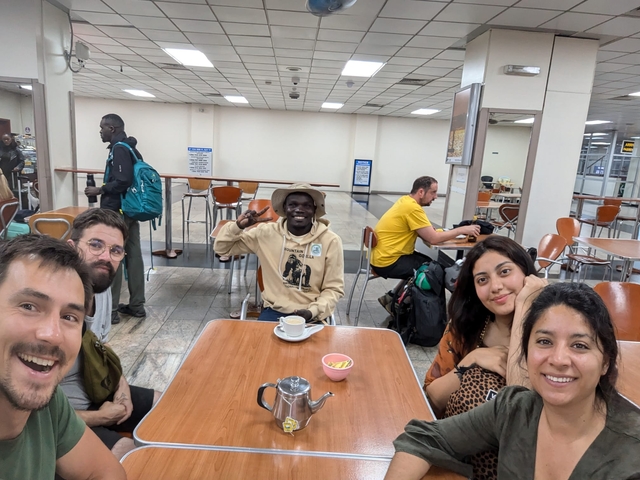 People sitting at a table in a cafe.