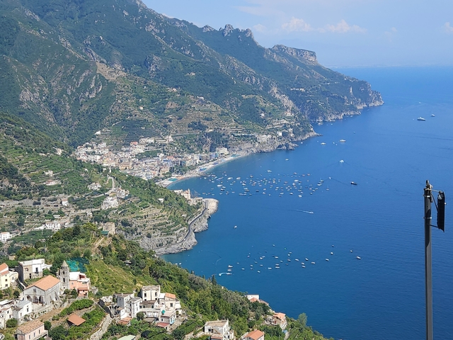 Aerial view of a coastline with mountains.