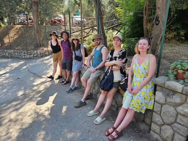 Group of people posing on a sunny day.