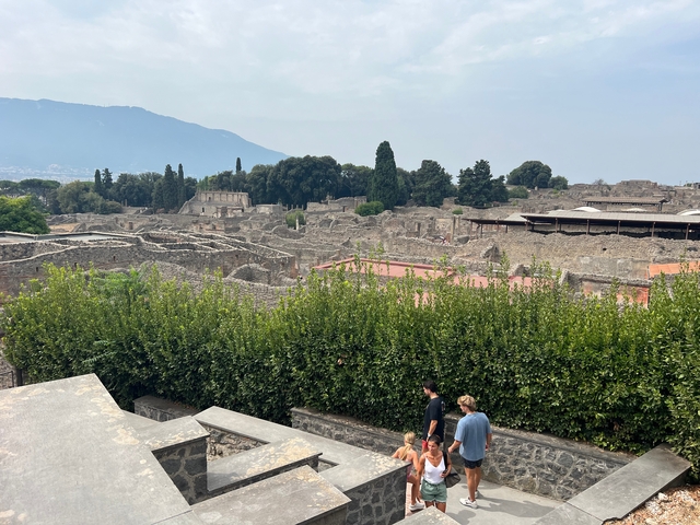 Ancient ruins with mountains in the background.