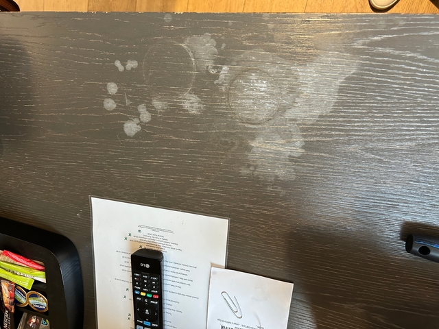 Dusty surface showing an indistinct pattern and stains.