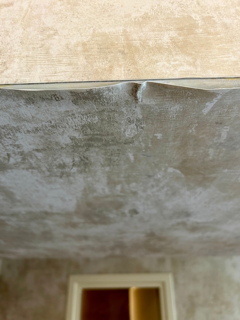 Close-up of a textured, dirty wall.