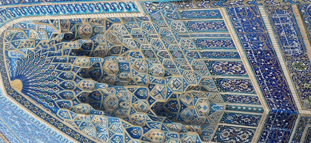 Close-up of intricate blue tile patterns in Islamic art