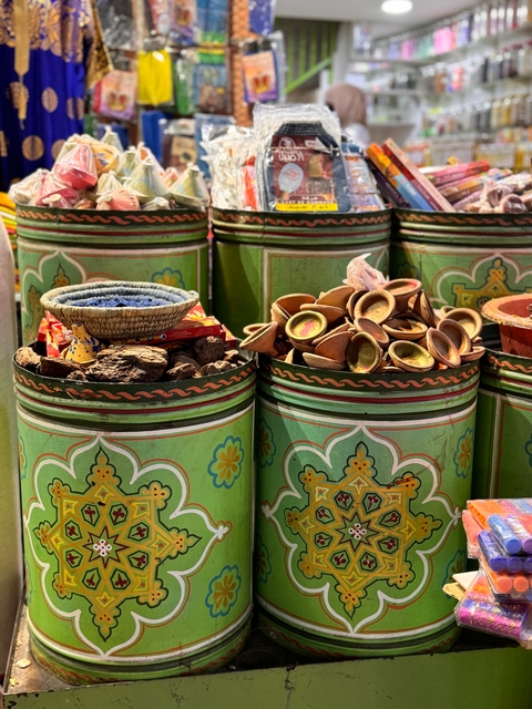 Colorful spice containers in a Moroccan market.