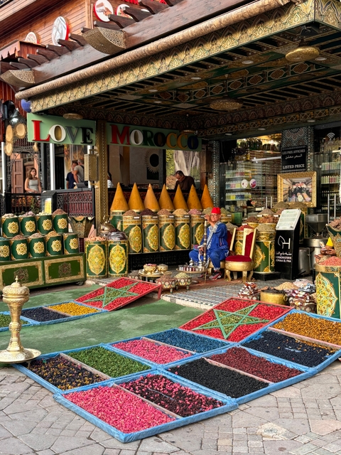 A Moroccan market stall with a colorful display of spices.