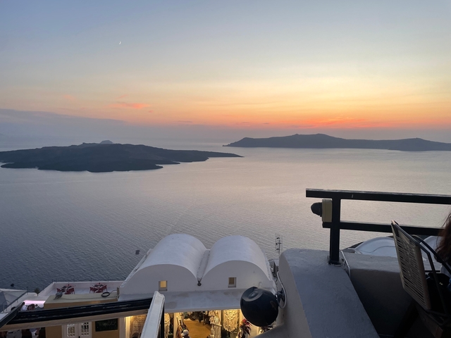 Sunset view over the sea with islands in the distance.