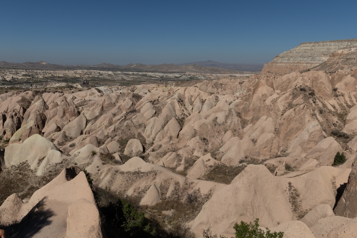 Rocky terrain and valleys in a barren landscape.