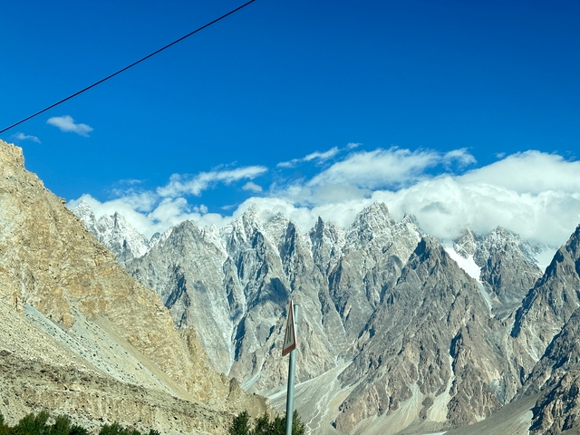 Snow-capped mountain range under a clear blue sky.