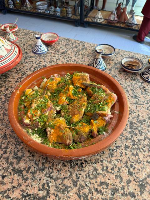 Moroccan tagine dish seasoned with herbs and spices.
