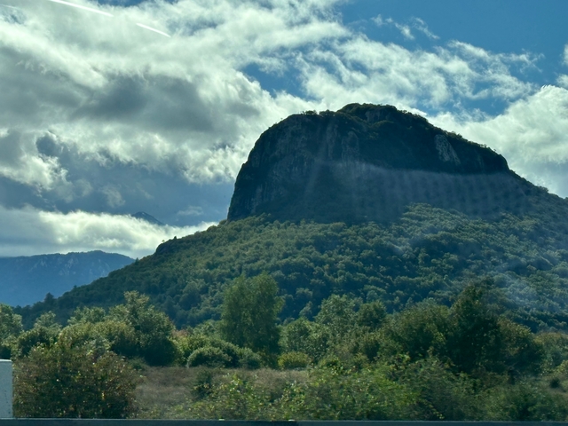 Mountain landscape with lush greenery.