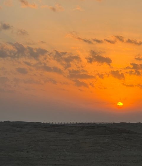 Vibrant sunset with clouds.