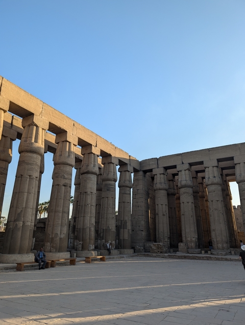 Ancient temple columns with blue sky.