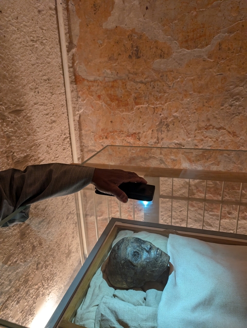 Person using a phone flashlight.