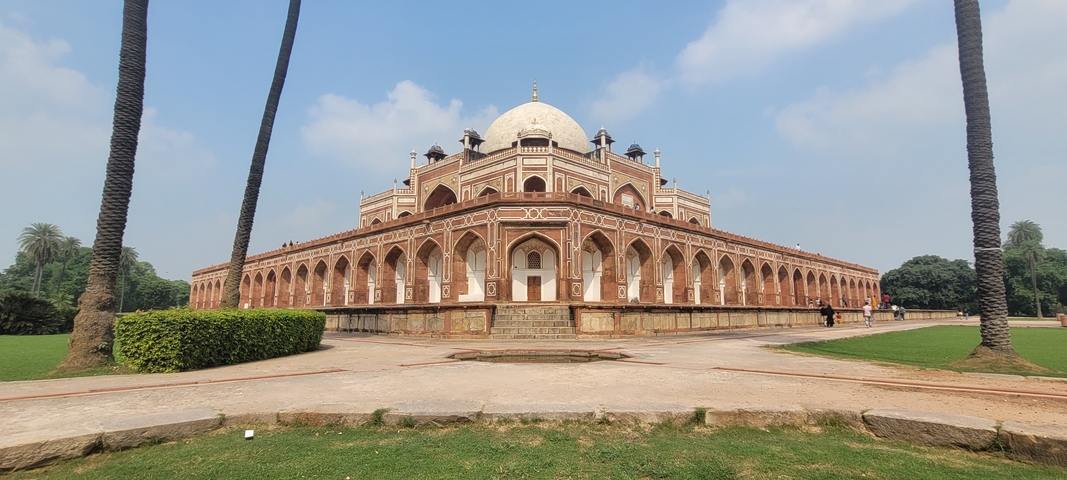 Grand historical building with a dome and arches.