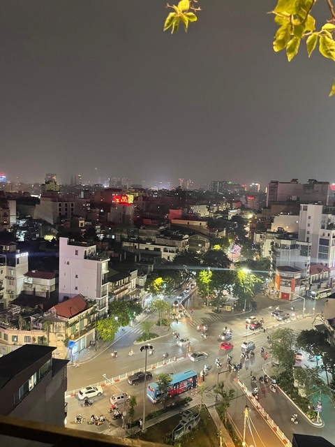 Night view of a city skyline with distant lights.