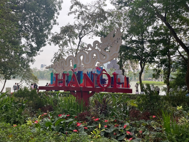 Scenic area with a large sign that says 'Hanoi'.