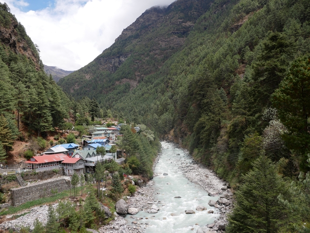 A small village along a river in a mountain valley.