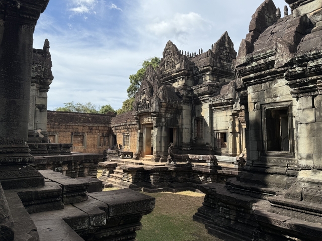 Ancient stone temple ruins with detailed carvings.