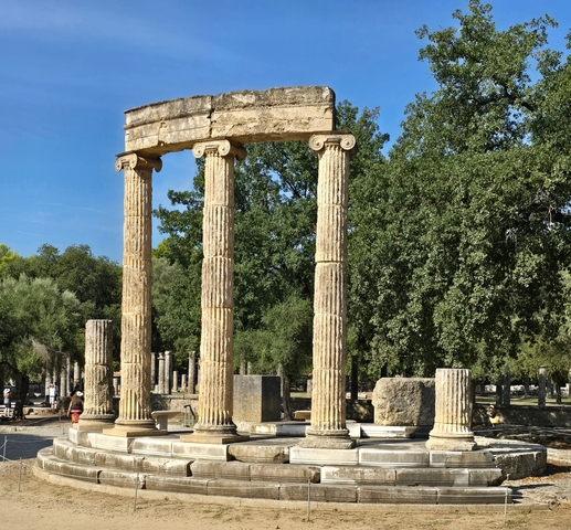 Ancient columns with an open area seating arrangement.