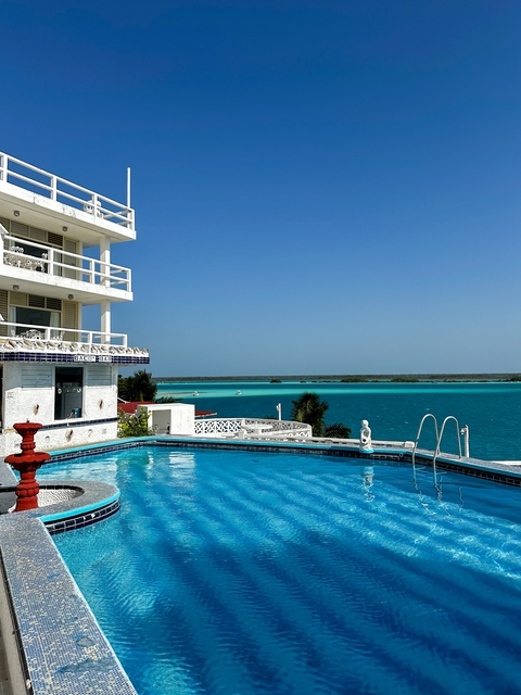 Luxury resort with a pool and ocean view.