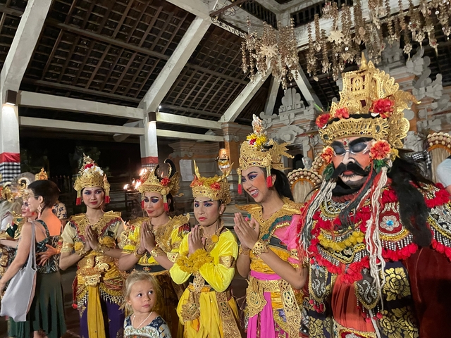 Cultural performers in elaborate costumes.