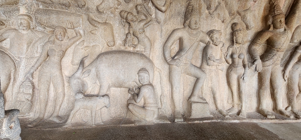 Ancient stone carvings depicting people and animals.