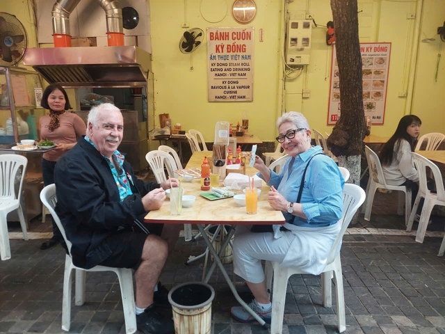 Couple dining in an outdoor Vietnamese restaurant.