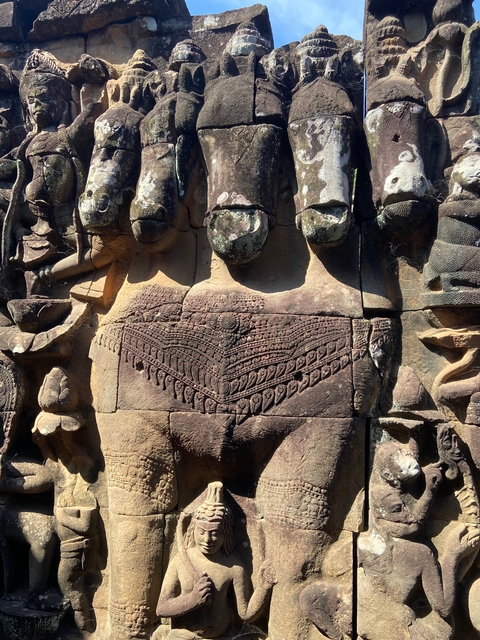 Intricate stone carvings on an ancient temple wall.